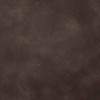 Dark brown mottled texture with granular surface, exhibiting tonal variations and a matte finish, possibly leather or fabric, with a light speck.